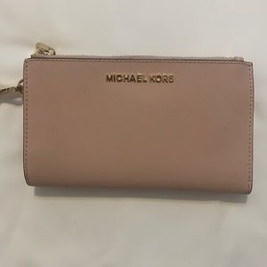 Michael Kors pink wristlet with cell-phone pocket